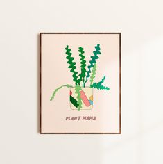 a plant in a pot with the words plant mama on it hanging from a wall