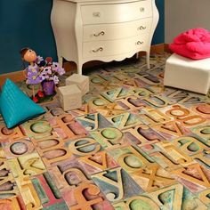 the floor is covered in colorful letters and numbers, including one for children's room