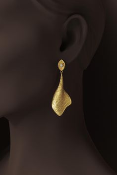 Elegant Long Dangle Drop Earrings in 14K or 18K Gold | Oltremare Gioielli Elevate your style with these stunning long dangle drop earrings, meticulously crafted in Italy by Oltremare Gioielli. Available in 14k or 18k gold, these elegant earrings showcase a modern silhouette, measuring 65mm in length and 22mm in width. The textured drop design is inspired by the beauty of nature, featuring a unique, earthy ground texture that adds depth and character. At the top, a brilliant 2.7mm diamond (G colo Ground Texture, Drop Design, Italian Jewelry, Black Gift Boxes, Gold Jewellery Design, Drops Design, Gold Earrings Dangle, Earrings Dangle, Elegant Earrings