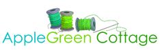 the apple green cottage logo with spools of thread and spools of yarn