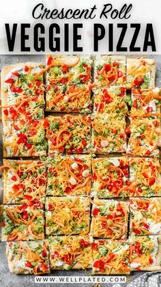 a pizza with cheese and veggie toppings on it is cut into squares