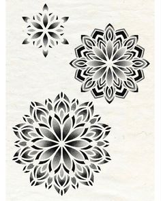 three black and white flower designs are shown in this drawing technique, one is drawn on paper