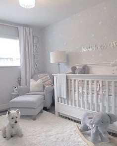 a baby's room with a crib, rocking chair and stuffed animals