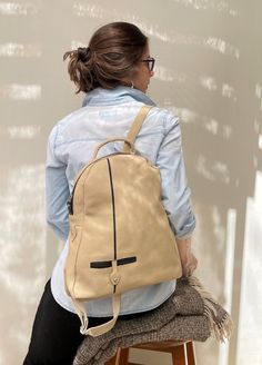 Beige zipped leather backpack Chic Soft Leather Travel Backpack, Versatile Leather Backpack With Zipper Closure, Chic Soft Leather Backpack For Daily Use, Everyday Leather Backpack With Zipper, Leather Softback Backpack With Zipper Closure, Chic Leather Backpack With Zipper Closure, Soft Leather Softback Backpack For On-the-go, Chic Leather Backpack With Zipper For Daily Use, On-the-go Soft Leather Softback Backpack