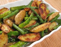 a white bowl filled with green beans and potatoes