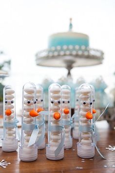 there are snowmen made out of plastic tubes with carrots in the shape of heads