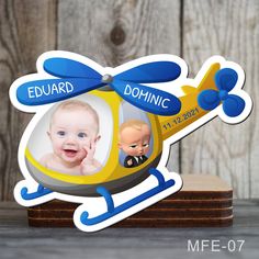 a baby is in a helicopter with the name eduard on it's side