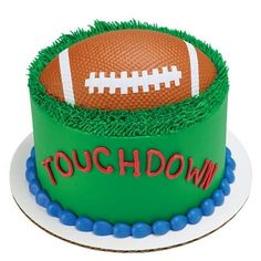 a birthday cake with a football on top