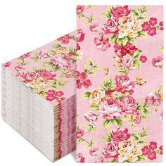 a stack of pink paper with flowers on it