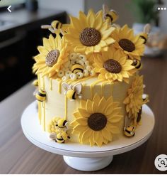 a cake with sunflowers and bees on it