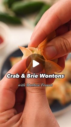 a person holding food in their hand with the caption crab and brie wontons