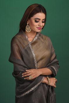 Slay with your elegance at parties and festive occasions in this gorgeous dark grey sequin embroidery georgette saree. It comes with a heavy embroidery blouse. Shop designer sarees online in USA from Pure Elegance. Disclaimer: The shown stitched blouse on the model is for display purpose only. The saree comes with a matching blouse and finished with fall and piko. Latest Designer Sarees, Designer Sarees Online, Fashion Journals, Tussar Silk Saree, Organza Saree, Embroidery Blouse, Traditional Fabric, Sequins Embroidery, Georgette Sarees