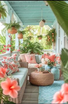 the porch is decorated with tropical plants and wicker furniture