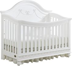 a white crib with no sheets on it