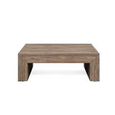 a wooden coffee table sitting on top of a white floor with no one around it