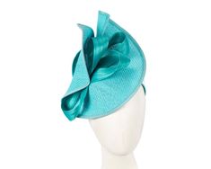 Large turquoise twisted plate decorated with silk abaca bow. Hand made in Melbourne by our skillful milliners, this headpiece will be a crown jewel of your spring racing outfit.  Made in Australia  Exclusive materials  Stylish design by Fillies Collection  Comfortable headband Turquoise Headpieces For Kentucky Derby, Turquoise Headpiece For Kentucky Derby Races, Elegant Turquoise Headpiece For Wedding, Elegant Turquoise Wedding Headpiece, Elegant Turquoise Fascinator For Races, Elegant Turquoise Fascinator For Royal Ascot, Elegant Turquoise Fascinator For Kentucky Derby, Spring Turquoise Headpiece For Parties, Turquoise Mini Hats For Royal Ascot Races