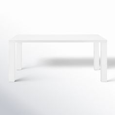 a white table sitting on top of a white floor