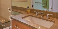 a bathroom with a sink, mirror and shower stall in the middle of it's countertop