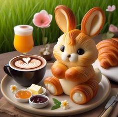 there is a statue of a bunny sitting on a plate next to a cup of coffee