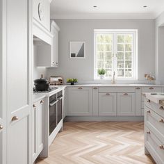 a kitchen with grey cabinets and white counter tops