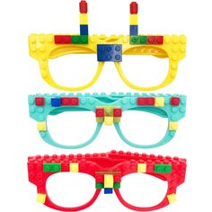 three pairs of glasses with legos on the lenses and one pair is red, yellow, blue, and green