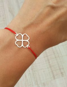 Lucky Four Leaf Clover Bracelet Silver Clover Red String Bracelet Good Luck Bracelet Red Silk String Bracelet Lucky Four Leaf Gift Minimalist String Bracelet Clover Jewelry - perfect as a gift for a best friend or for that beach/surfer look - adjustable bracelet - waterproof - Sterling Silver clover (21mm) Primary color for string is red. If you want another color, please select from Secondary color. Visit our shop here: https://www.etsy.com/your/shops/ParticleJewelry Elegant Red Bracelet For Gift, Dainty Red Adjustable Bracelet, Dainty Adjustable Red Bracelet, Elegant Red Friendship Bracelets, Elegant Red Bracelets For Friendship, Minimalist Red Jewelry As Gift, Red Bracelet Jewelry Gift, Red Bracelet Jewelry For Gifts, Red Hypoallergenic Bracelet For Valentine's Day