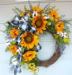 a wreath with sunflowers and cotton balls