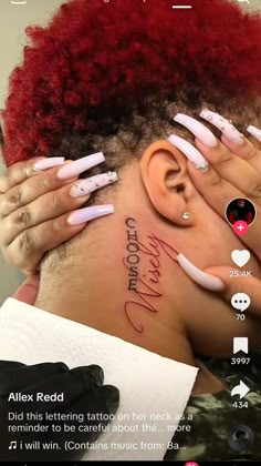 a woman with red hair and white nails has her face covered by fake nail art