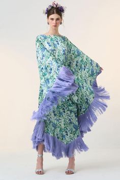 Blue kaftan with all over floral bloom print.
Components: 1
Pattern: Print
Type Of Work: Floral
Neckline: Boat Neck
Sleeve Type: Cape Sleeves
Fabric: Satin
Color: Blue
Other Details: 
Silk fringes all over hemline
Note: The belt worn by the model is not for sale
Occasion: Resort - Aza Fashions Floor-length Kaftan For Spring Vacation, Floor-length Spring Vacation Kaftan, Spring Vacation Floor-length Kaftan, Spring Kaftan With Tassels And Kimono Sleeves, Silk Floral Print Floor-length Kaftan, Floor-length Silk Kaftan With Floral Print, Green Floral Print Long Sleeve Kaftan, Bohemian Floral Print Floor-length Kaftan, Spring Floral Print Floor-length Kaftan