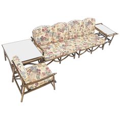 a set of three couches and two chairs with matching footstools in floral fabric