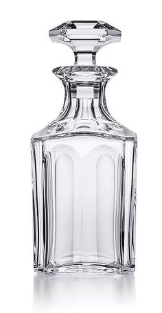 an empty glass bottle on a white background