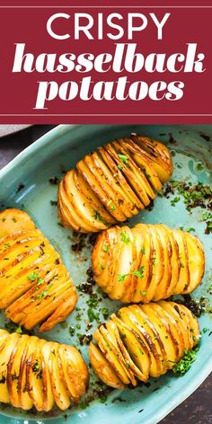 crispy hasselback potatoes on a blue plate with parsley sprinkled on top