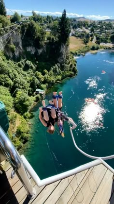 a person is parasailing over the water