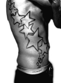 black and white photo of a man's back with stars on his left side