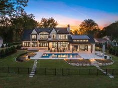 a large house with a pool in the front yard