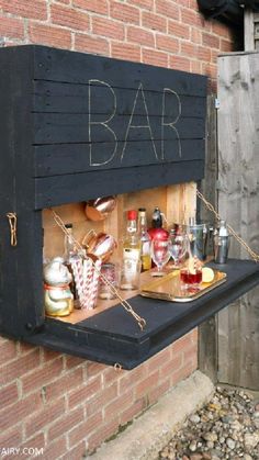 an outdoor bar with drinks on it