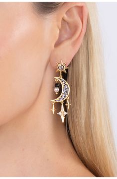 Colorful cubic zirconia stones add sparkle to statement making crescent moon earrings that will add celestial vibes to your look. 2" length Post back Brass/cubic zirconia Imported Celestial Earrings, Crescent Moon Earrings, Earrings In Gold, Cz Earrings, Moon Earrings, Blue Moon, Crescent Moon, Crescent, Eye Candy