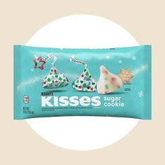 a bag of kisses sugar cookies sitting on top of a white circle