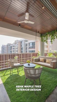 an outdoor living area with grass and furniture