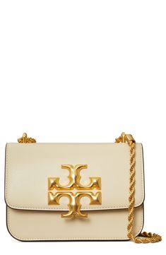 A bold logo medallion makes a gleaming statement on a finely grained leather handbag furnished with a pull-through strap for shoulder or crossbody carry. Style Name:Tory Burch Small Eleanor Convertible Leather Shoulder Bag. Style Number: 6097591. Available in stores. Types Of Handbags, Tory Burch Crossbody Bag, Tory Burch Crossbody, Bold Logo, Shoulder Chain, Tory Burch Bag, Online Bags, Free Bag, Chain Strap