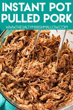 the instant pot pulled pork is being cooked in a bowl with tongs on top