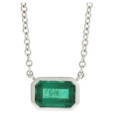 --Stone(s):-- (1) Natural Genuine Emerald - Emerald Cut - Bezel Set - Clean Vivid Green Color - Very Nice Quality - 6x4mm - 0.60ct (approx.) Total Carat Weight: 0.60 (approx.) Material: Solid 18K White Gold Weight: 2.78 Grams Chain Type: Cable Link Chain Length: 18 Inches (measured next to a ruler with pendant) Clasp: Lobster Claw Pendant Width: 7.2mm (0.28") Pendant Height: 5mm (0.19") Pendant Thickness: 3.1mm Stamp: Kwiat - 129296 - 18K Condition: Comes w/ original inner & outer box. Excellent Classic Emerald Necklace With Bezel Setting, Classic Bezel Set Emerald Pendant Necklace, Classic Emerald Pendant Necklace In Bezel Setting, Classic Emerald Pendant Necklace With Bezel Setting, Classic Emerald Necklaces With Bezel Setting, Classic Sterling Silver Emerald Necklace With Prong Setting, Fine Jewelry Emerald Necklace With Bezel Setting For Anniversary, Solitaire Pendant Necklace, Solitaire Pendant