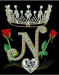 a tiara and two roses with the letter j on it, surrounded by diamonds