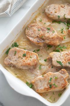 a casserole dish filled with meat and potatoes