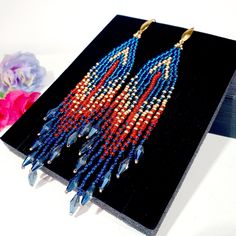 "Seed Bead Earrings 4 inch long.Flowing beads earrings.Bohemian dangle beaded earrings. with fringe are made of high quality Czech and Japanese seed beads. long earrings.Bead weaving techniques. Colors: Sea blue, Matt Gold and Berry red color. ! Details ! Made with quality Japanese and Czech seed beads. Czech crystals. ! Professional threads for weaving with beads Tytan and Fireline. ! Length 4 inches ( 11cm) ! Gold tone metal ear wire. Simple sterling silver ear wire 925 are included with each Bohemian Crystal Earrings With Faceted Beads, Bohemian Beaded Crystal Earrings, Bohemian Dangle Crystal Earrings With Colorful Beads, Bohemian Crystal Dangle Earrings With Colorful Beads, Long Seed Bead Earrings, Earrings With Crystals, Earrings Bead, Beaded Earrings Native, Boho Style Earrings