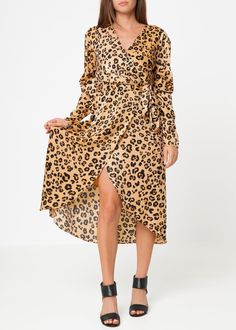 Feel the power of our Brown Leopard Print Puffy Shoulder Dress! With its voluminous shoulder detailing, waist cinching wrap design, and comfortable lining, you'll never want to take it off. Made with 100% polyester printed washed satin and brought to you by our friends at Shop at Konus. Chic Ruched Wrap Dress For Fall, Flowy Chic Wrap Dress For Fall, Spring Leopard Print Ruched Dress, Leopard Print Ruched Dress For Spring, Fall Wrap Dress With Tie Waist For Brunch, Spring Ruched Wrap Dress, Spring Wrap Dress With Ruched Detail, Flowy Wrap Dress For Fall, Puffy Shoulder Dress