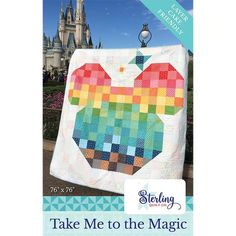 an apple quilt is displayed in front of a castle with the words take me to the magic kingdom on it