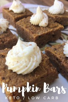 pumpkin bars on a plate with whipped cream