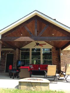 a patio covered with furniture and a ceiling fan