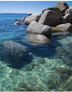 the water is crystal clear and there are rocks in it